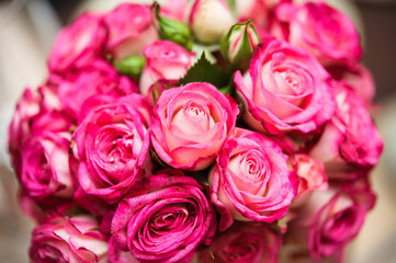 Colorful wedding bouquet on a restaurant served table. Bridal bouquet. Luxury pink roses. Valentine's day, birthday, dating or mother's day decoration