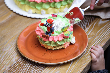 Little girl birthday party table with princess cake, macaroons, cupcakes, and sugar cookies. Candy bar for kids. Sweet holiday buffet with sweets and other desserts.