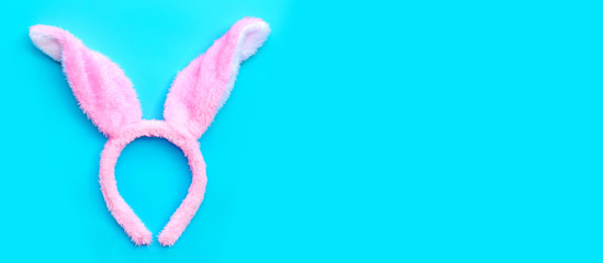 Happy Easter holiday background, Easter bunny ears on a blue background.