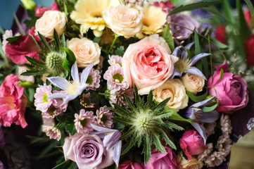Colorful wedding bouquet on a restaurant served table. Bridal bouquet. Luxury royal restaurant. Valentine's day, birthday, dating or mother's day decoration