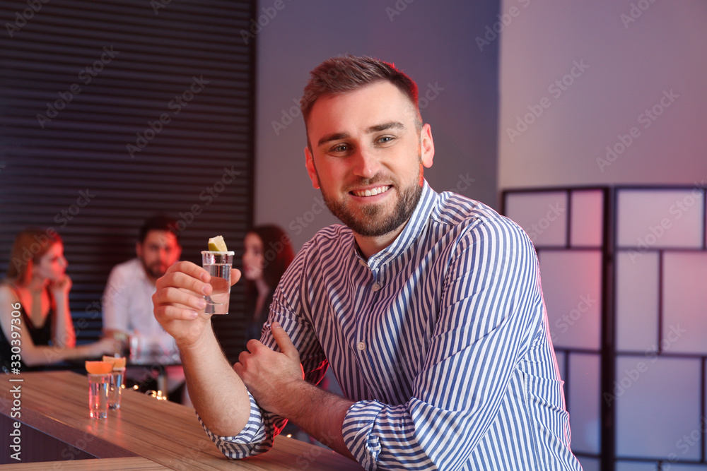 Sticker young man with mexican tequila shot at bar