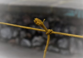 two ends of rope are tightly knotted