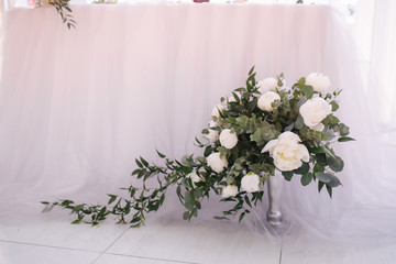 Different decor on wedding. Flowers, stools, rings champagne.