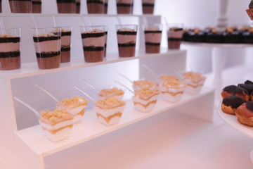 Candy bar on wedding. Sweets and decerts in restairant