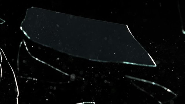 Super Slow Motion Shot of Real Glass Break at 1000 fps Isolated on Black Background.
