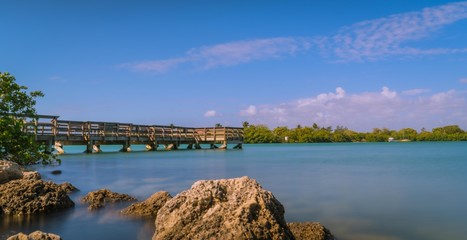 Obraz premium aquatic bridge lake landscape river panorama nature blue impressions architecture bridge bay florida summer tourism clouds trees