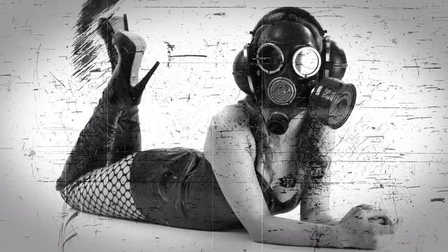 woman lying on floor with gasmask