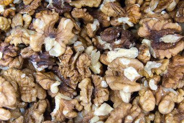 Unshelled walnuts. Background of fresh walnuts.