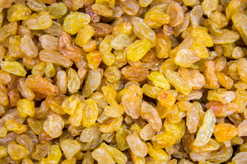 Golden raisins beautiful appetizing background