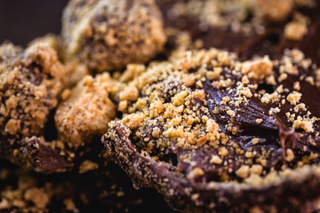 details of chocolate with peanuts, Brazilian and homemade Easter egg, focal point in macro image.