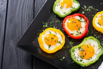 Yellow , red and green pepper with fried eggs