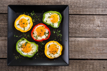 Yellow , red and green pepper with fried eggs