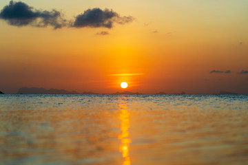 Beautiful sunset over the sea water on the island of Koh Phangan, Thailand. Travel and nature concept