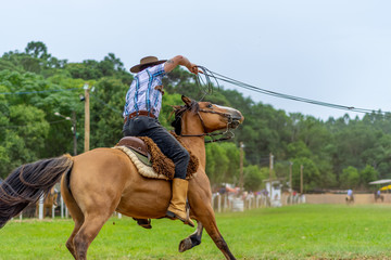 man riding a horse at a Creole rodeo 