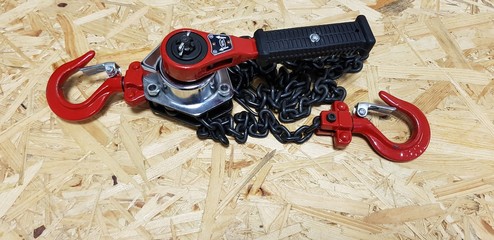 lever hoist or pull lift on a wooden background