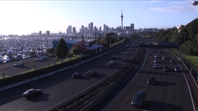 Busy motorway in urban area. Early morning. Sunrise.