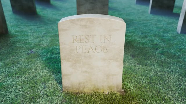 Zooming-in view at the tombstone at creepy graveyard. Night. Fog. Meadow. 4k HD
