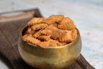 Namakpara (Khurma, Nimki, Mathri) which is a crispy, crunchy and savory strips in a bowl.
