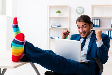 Young male businessman working in the office