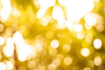 Fototapeta premium white bokeh blur background / Circle light on yellow background / Light gold sparkle background