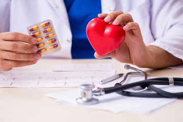 Young male doctor cardiologist working in the clinic