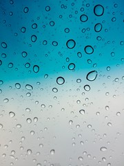 Fototapeta na wymiar water drops on blue and gray background