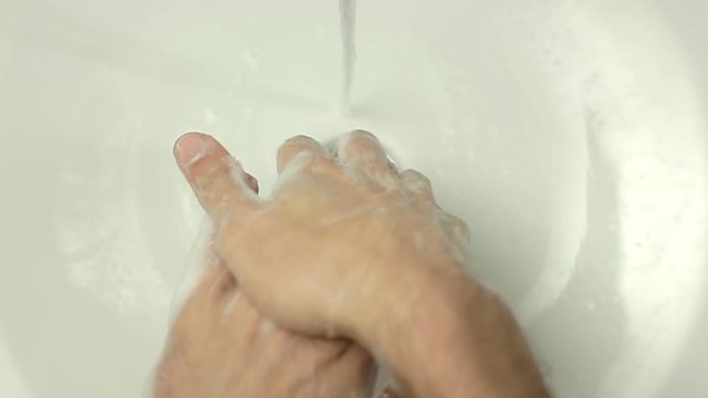 Top view close up of Man washing hands in slow motion