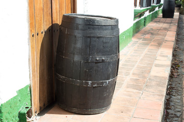  Old wooden barrel outside a house