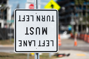 Upside Down "Left Lane Must Turn Left" Street Sign