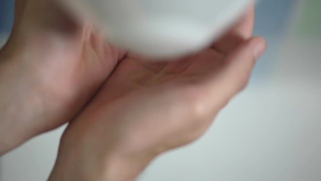 Closeup of man applying soap in bathroom