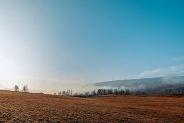 Autumn landscape early morning with fog