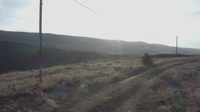 Man running to look over highway.Kaspi, Georgia - Aerial shot