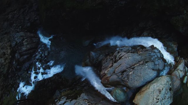 Drone Overhead Waterfall Water Flowing Over Rocky Cliff Edge