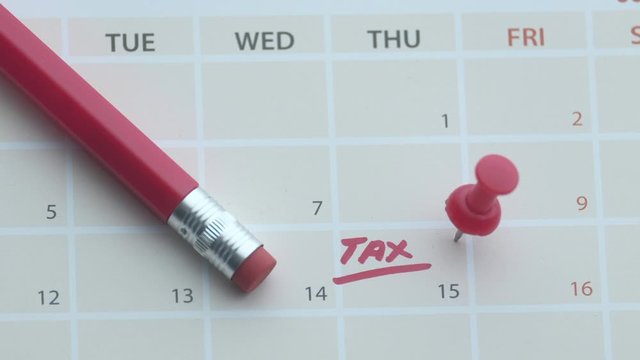 Tax day concept. The USA tax due date marked on the calendar