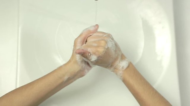 Top view close up of Woman washing hands in slow motion