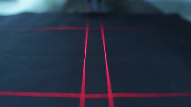 The point where the fabric will be cut is calculated with the laser measuring machine.