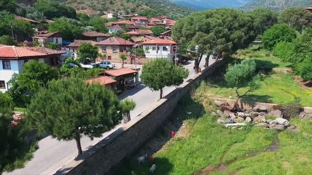 aerial shots with the drone of the old historic village of Birgi in Turkey. stone houses and nature image. 4K. wide-angle shooting.