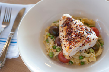 Grilled Chicken Breast over Fettuccine Alfredo