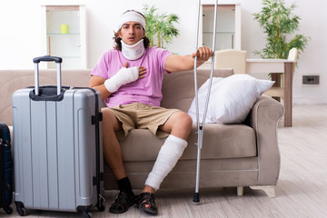 Young injured man preparing for the trip