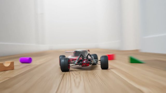RC car indoor race. Miniature radio-controlled model driving fast in the house.