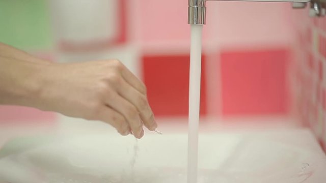 Closeup of Woman washing hands in slow motion