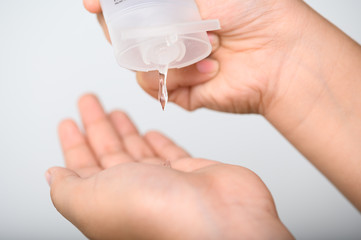Hands Applying Sanitizer Gel. hands using wash hand sanitizer gel dispenser, against Novel coronavirus or Corona Virus Disease (Covid-19) at public . Antiseptic, Hygiene and Healthcare