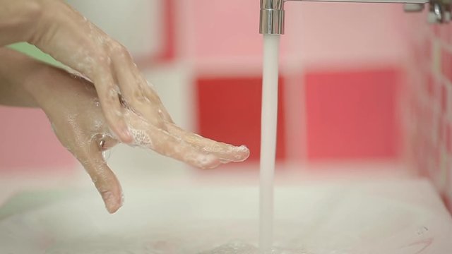 Closeup of Woman washing hands in slow motion