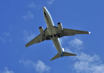 Landing the plane on a background of blue sky