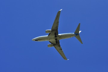 Landing the plane on a background of blue sky