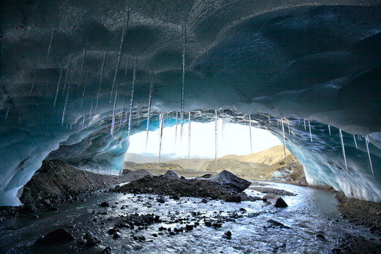 Ice Cave And River Under Eyjafjallajokull Glacier In Iceland