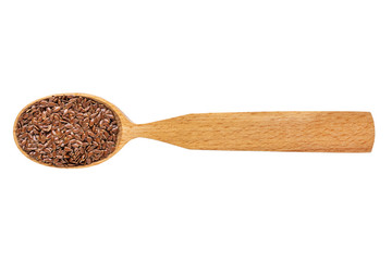 Dried Linum seeds in a wooden spoon on a white background. Phytotherapy and disease prevention. Herbal collection for medicinal tinctures. Herbal tea in folk medicine. The view from the top