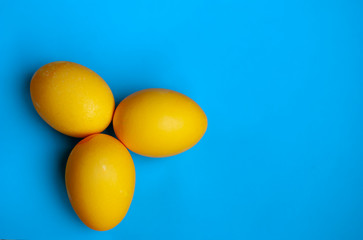 Yellow eggs on a blue background