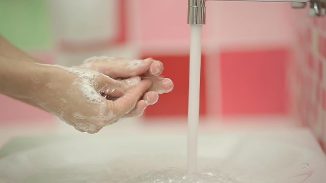 Closeup of Woman washing hands in slow motion