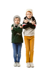 Cute little boys shaking with cold on white background